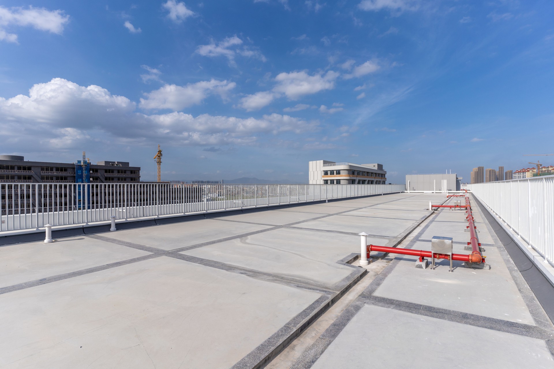 Roof maintenance equipment and surrounding buildings of modern buildings